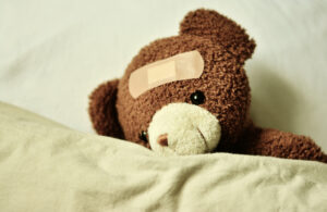 Canva - Cute Teddy Bear with a Bandage