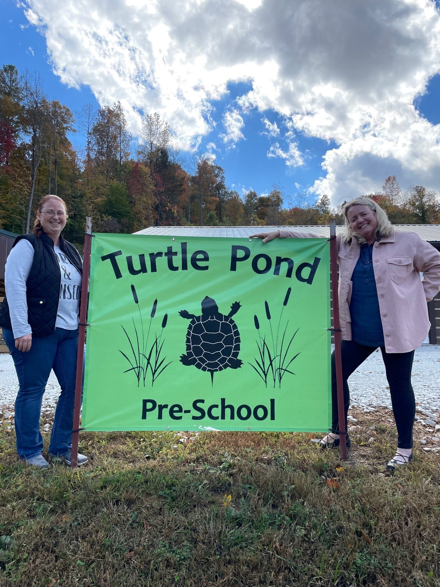 Cassie Young and Julia in front of Turtle Pond Preschool